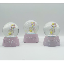 glass globe with ababy girl inside