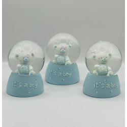 glass globe with ababy bear inside